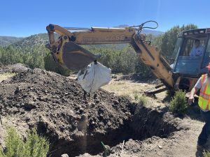 Provided by Tom Murphy An excavator lifts a body out of a grave in Starkville during an exhumation Sept. 6.